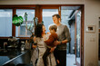 © Austockphoto - Family with young boy together in home dining room in late afternoon