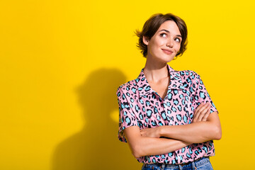 Wall Mural - Portrait of lovely smart lady folded hands look interested empty space brainstorming isolated on yellow color background