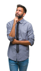 Poster - Adult hispanic business man over isolated background with hand on chin thinking about question, pensive expression. Smiling with thoughtful face. Doubt concept.