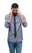 © Krakenimages.com - Adult hispanic business man over isolated background with hand on head for pain in head because stress. Suffering migraine.