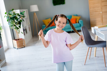 Poster - Photo of cheerful carefree girl have good mood arms hold pull hair tails free time spacious modern flat inside