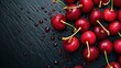 Above view of lots of red fresh cherry in drops of water on a black background surface. Berry fruit wallpaper, fresh cherries food concept banner.    