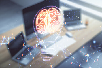 Wall Mural - Creative light bulb with human brain hologram and modern desk with computer on background, artificial Intelligence and neural networks concept. Multiexposure