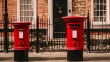 Two Post Boxes In Front Of House