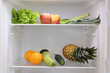 Open fridge full of fresh fruits and vegetables, healthy food background, organic nutrition, health care, dieting