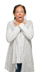 Poster - Beautiful middle age adult woman wearing winter sweater over isolated background shouting and suffocate because painful strangle. Health problem. Asphyxiate and suicide concept.