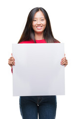 Poster - Young asian woman holding banner over isolated background with a happy face standing and smiling with a confident smile showing teeth