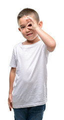 Sticker - Dark haired little child with happy face smiling doing ok sign with hand on eye looking through fingers