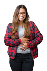 Poster - Young beautiful brunette woman wearing jacket and glasses over isolated background Smiling and laughing hard out loud because funny crazy joke. Happy expression.