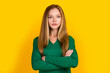 Portrait of attractive young blonde hair lady wear green jumper crossed arms feel herself like leader isolated on yellow color background