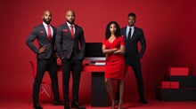 Three Black People In Suits And A Woman In A Red Dress On A Red Office Background. Celebrating Black History Month!