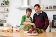 © pixs4u - Attractive mature couple cooking foods for breakfast in kitchen with happiness