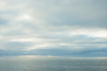 Grey Clouds And Ocean Horizon