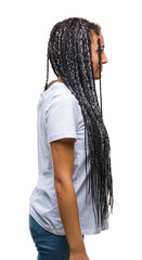 Sticker - Young braided hair african american girl over isolated background looking to side, relax profile pose with natural face with confident smile.