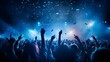 © Ziyan Yang - live, rock concert, party, festival night club crowd cheering, stage lights and confetti falling. Cheering crowd. Blue lights.