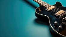 Electric Guitar With A Black Finish Over A Turquoise Background