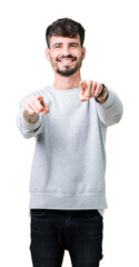 Sticker - Young handsome man wearing sweatshirt over isolated background Pointing to you and the camera with fingers, smiling positive and cheerful