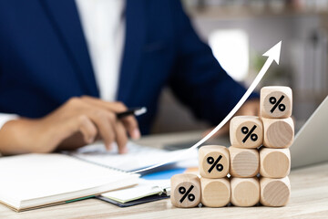 Investment growth wooden block with percentage symbol and up arrow for high returns Long-term financial strategy Interest rate and dividend concept for business success and investment for retirement.