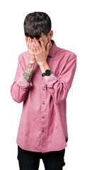 Wall Mural - Young handsome man wearing pink shirt over isolated background with sad expression covering face with hands while crying. Depression concept.