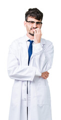 Sticker - Young professional scientist man wearing white coat over isolated background looking stressed and nervous with hands on mouth biting nails. Anxiety problem.