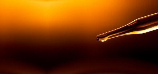 Wall Mural - yellow science test tube,dropping yellow chemical liquid or essential oil to test tube on white back