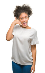 Sticker - Young afro american woman over isolated background smiling doing phone gesture with hand and fingers like talking on the telephone. Communicating concepts.