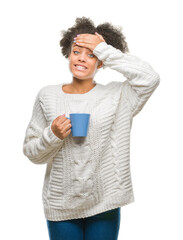 Canvas Print - Young afro american woman driking cup of coffee over isolated background stressed with hand on head, shocked with shame and surprise face, angry and frustrated. Fear and upset for mistake.