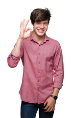 Wall Mural - Young handsome business man over isolated background smiling positive doing ok sign with hand and fingers. Successful expression.