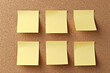 © alexandr - Six yellow sticky notes on cork board background