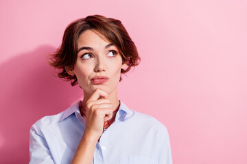 Poster - Portrait of creative minded person hand touch chin look empty space brainstorming isolated on pink color background