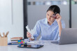 © Tj - A beautiful young Asian woman holding file document working in the office and reading the notebook on the Dest.