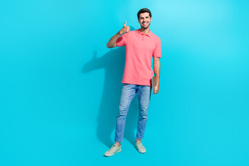 Sticker - Full body length photo of young positive successful guy thumb up symbol bring light weight netbook isolated on aquamarine color background