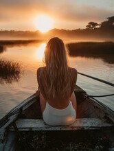 Beautiful Girl Sailing On A Boat Against The Background Of A Beautiful Sunset, Sea, Ocean, Travel, Summer Vacation Of A Young Woman