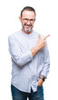 © Krakenimages.com - Middle age hoary senior man wearing glasses over isolated background cheerful with a smile of face pointing with hand and finger up to the side with happy and natural expression on face.