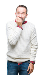 Poster - Middle age hoary senior man wearing winter sweater over isolated background looking stressed and nervous with hands on mouth biting nails. Anxiety problem.