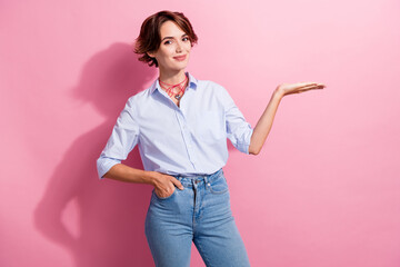 Poster - Portrait of positive gorgeous lady arm palm hold demonstrate empty space advert isolated on pink color background