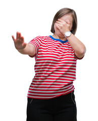 Sticker - Young adult woman with down syndrome over isolated background covering eyes with hands and doing stop gesture with sad and fear expression. Embarrassed and negative concept.