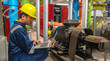 Maintenance technician at a heating plant,Petrochemical workers supervise the operation of gas and oil pipelines in the factory,Engineers put hearing protector At room with many pipes