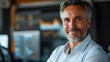 © Lumina - Smiling Mature Business Man Crypto Broker at Work - Financial Investor, Trader, Expert Adviser