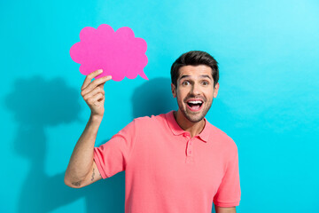 Sticker - Photo of young crazy guy in pink t shirt holding bubble cloud surprised chatterbox secrets isolated on aquamarine color background