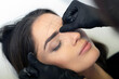 © forma82 - Eyebrow shape correction in a professional salon.