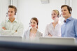 © Stefanie - Colleagues working in a call center with a very friendly atmosphere. Munich, Germany