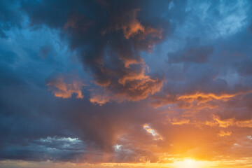 Wall Mural - glowing real sky at sunset texture background overlay. dramatic red and orange clouds.