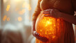 magic  of life concept with mid section shot of woman holding her glowing pregnant belly