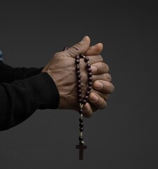 man praying to god Caribbean man praying with black grey background with people stock photo	