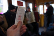 person in the historic train with an old ticket in Prague
