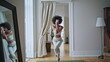 © stockbusters - Yoga model practicing asana at home zoom on. African woman performing stretching