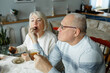 © Ala - Nice elderly couple together on a white background