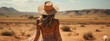 © alexkich - attractive sensual young woman in dress in desert, treveling on safari, wearing hat, exploring nature, hot summer day, sunny weather