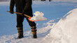 © Parilov - City service cleaning snow winter with shovel after snowstorm, sunlight